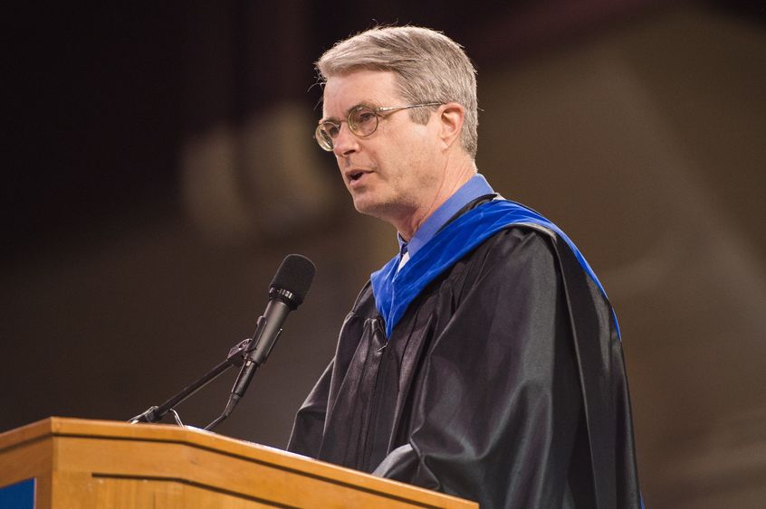 Penn State Behrend professor Jonathan Hall speaks during a commencement program.