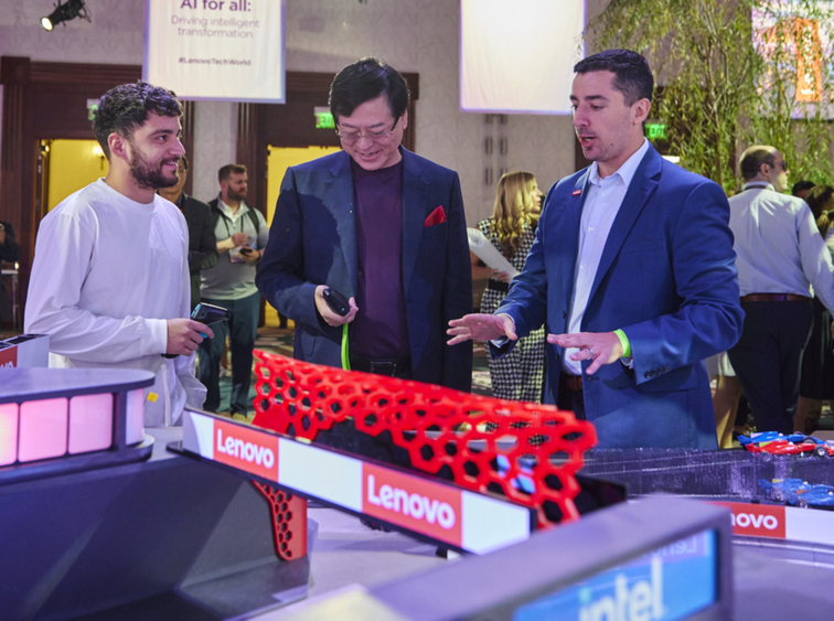 Penn State Behrend alumnus Jon Wolff talked with Lenovo CEO Yang Yuanqing at a model racetrack.