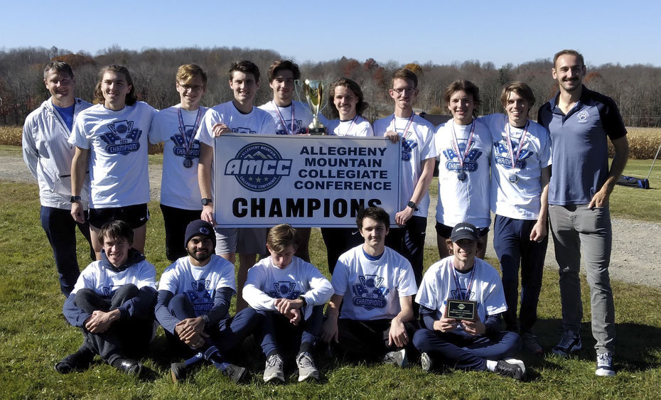 A group photo of the Penn State Behrend men's cross country team with an AMCC championship banner.