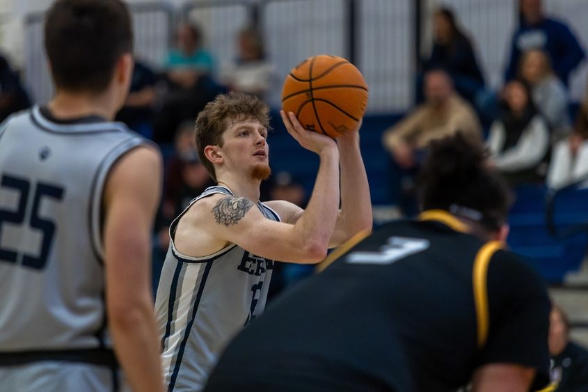 A Penn State Behrend basketball player shoots a free throw.