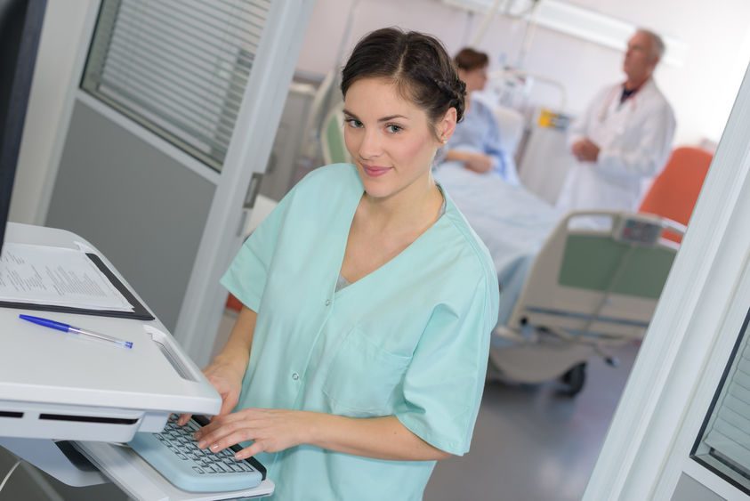 A clinical medical assistant works in a medical office.