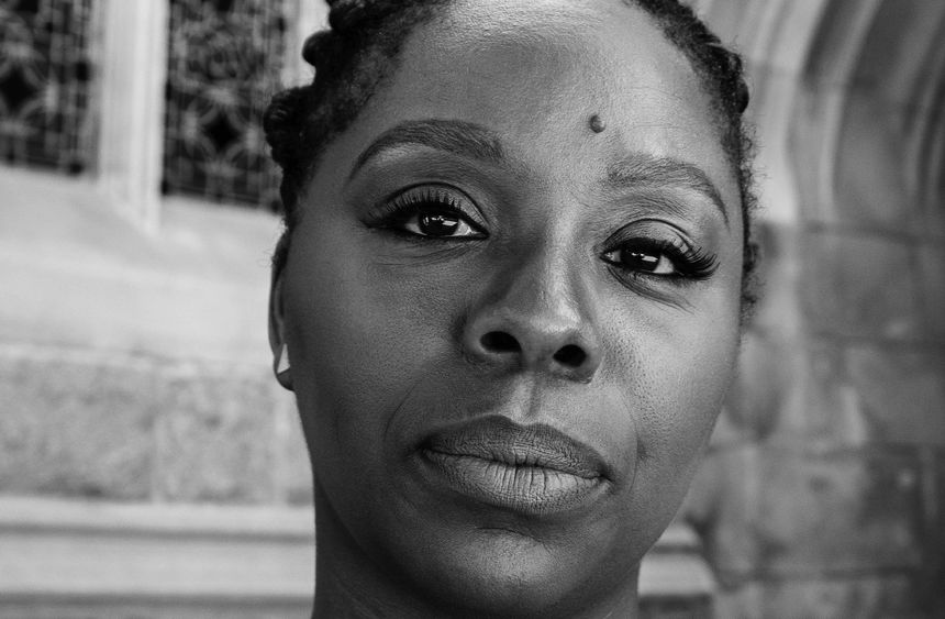 A black-and-white photo of Patrisse Cullors, co-founder of the Black Lives Matter movement