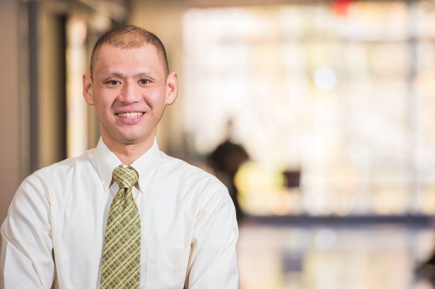 A professor stands in Burke Center at Penn State Behrend.