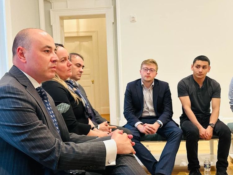 Two students from Penn State Behrend listen to a discussion with the Romanian ambassador during a recent visit to Washington, D.C.
