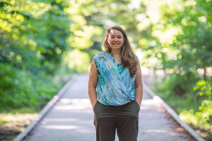 Sam Mason, director of sustainability at Penn State Behrend, poses on a boardwalk in Wintergreen Gorge.