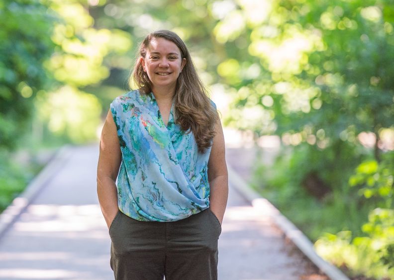 Sherri "Sam" Mason stands on a footbridge in Wintergreen Gorge