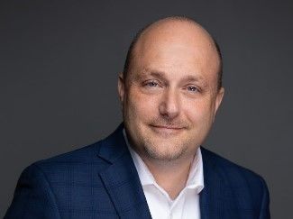 A portrait of Steven Bugajski, an executive in residence at Penn State Behrend's Black School of Business