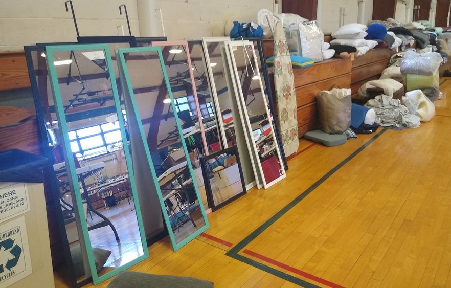 Stacked mirrors and other housewares at the Penn State Behrend Trash 2 Treasure sale.