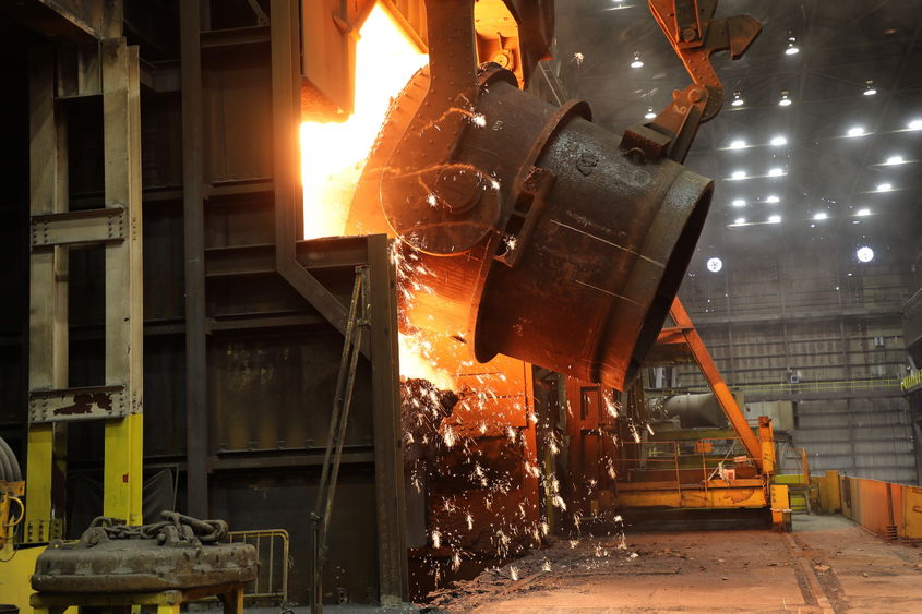 A ladle of molten iron is poured into a U.S. Steel blast furnace.