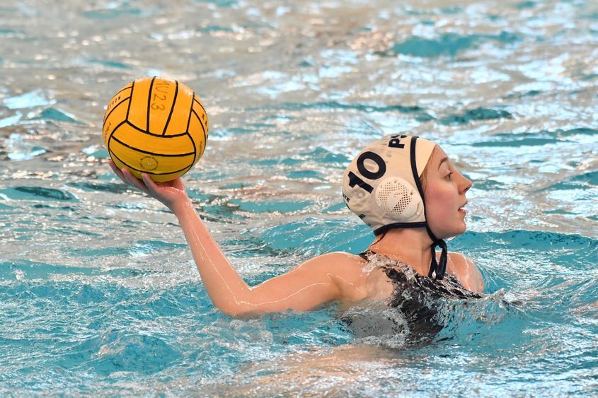 A Penn State Behrend women's water polo team player prepares to throw the ball.