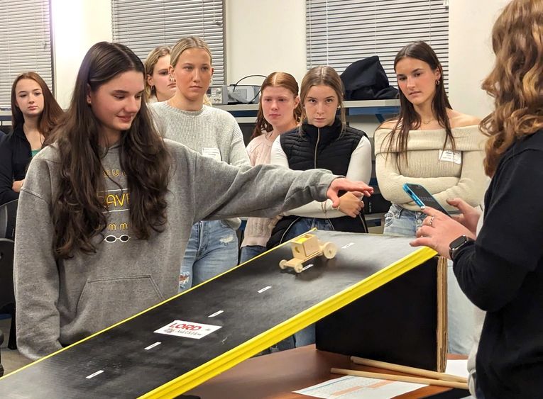 High-school girls test a model car during an engineering program at Penn State Behrend.