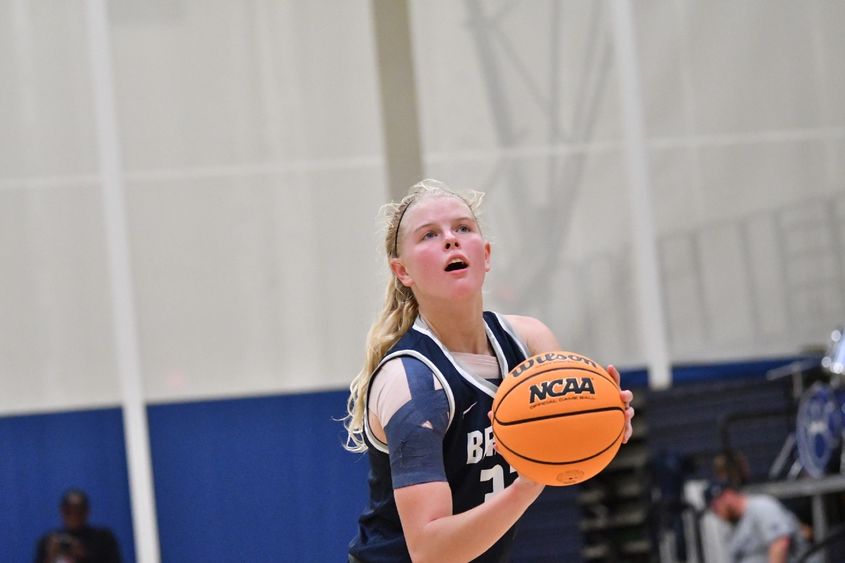 A member of the Penn State Behrend basketball team prepares to shoot the ball.