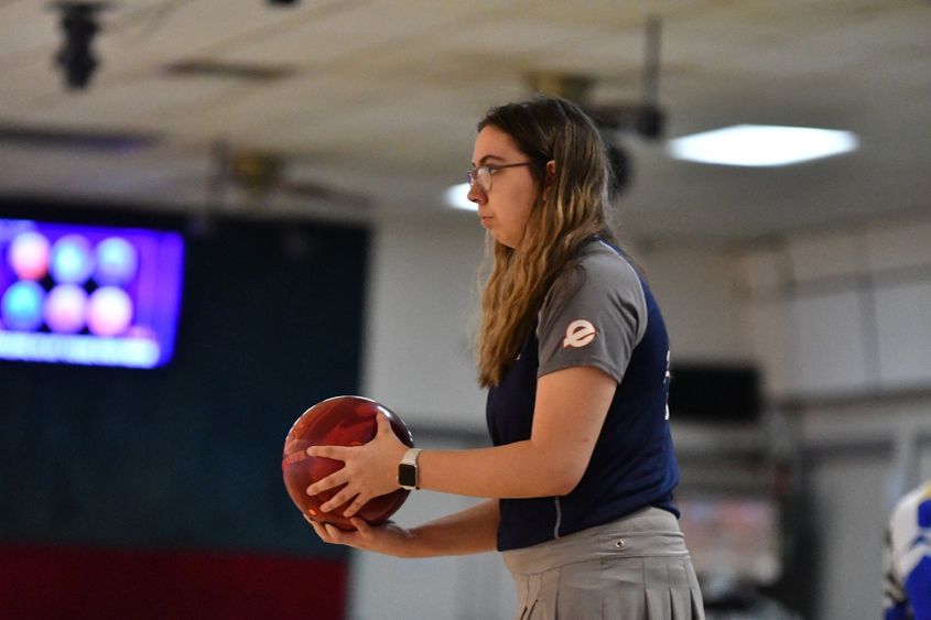 A member of the Penn State Behrend women's bowling team prepares to roll the ball.