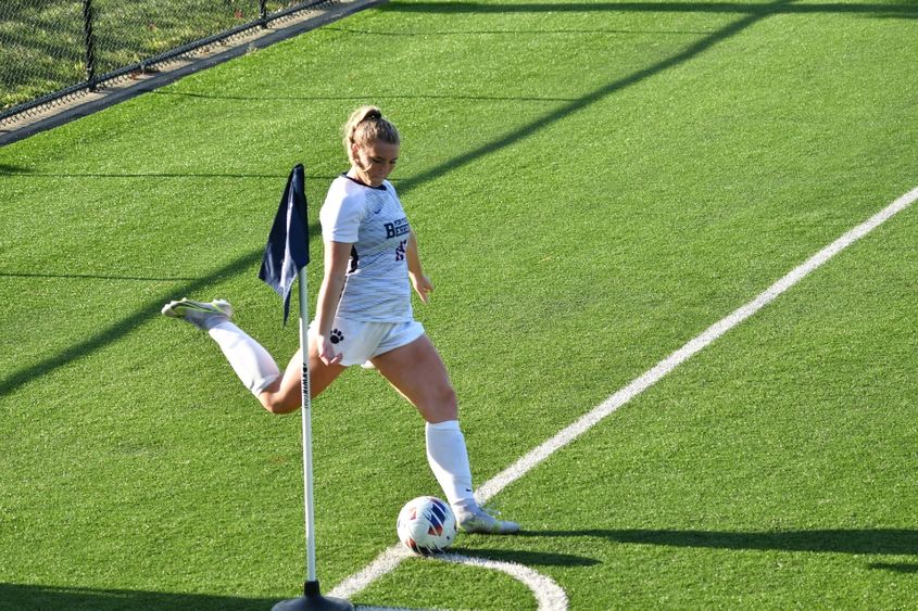 A Penn State Behrend women's soccer player prepares to kick a corner kick.