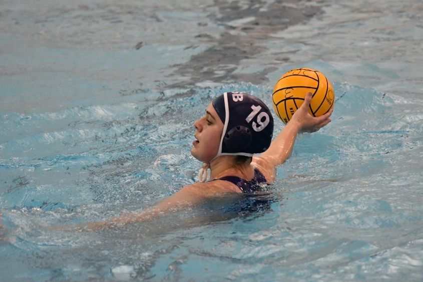 A Penn State Behrend water polo player prepares to throw the ball.