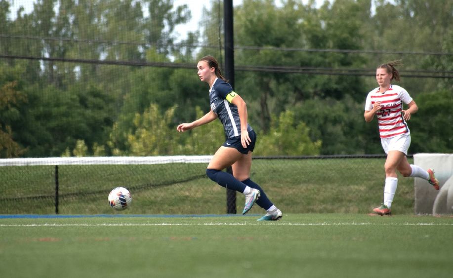 A Penn State Behrend women's soccer play prepares to kick the ball.