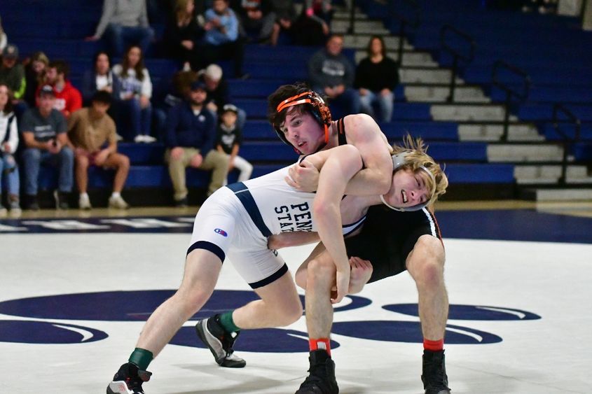 Two wrestlers grapple during a meet at Penn State Behrend.