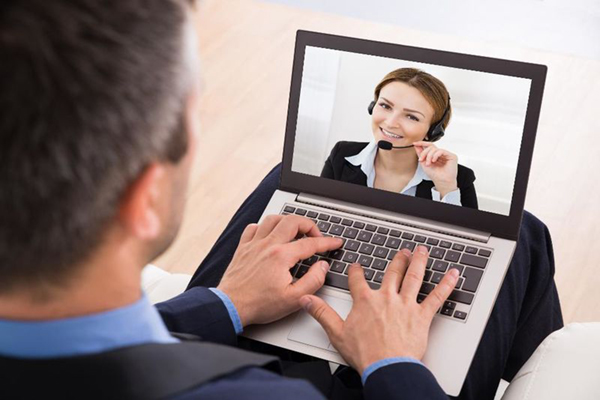 Male on computer talking to female on screen