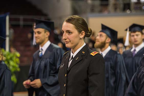 A Penn State Behrend ROTC graduate walks at commencement.