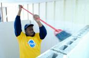 A Penn State Behrend student assists with renovations at the ANNA Shelter in Erie.