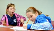 Students react to the taste of jellybeans during a program at Penn State Behrend.