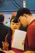 A student talks with a recruiter at the Penn State Behrend Career and Internship Fair