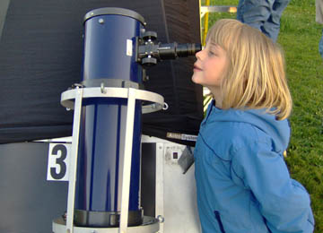 Girl with telescope at Open House in Astronomy