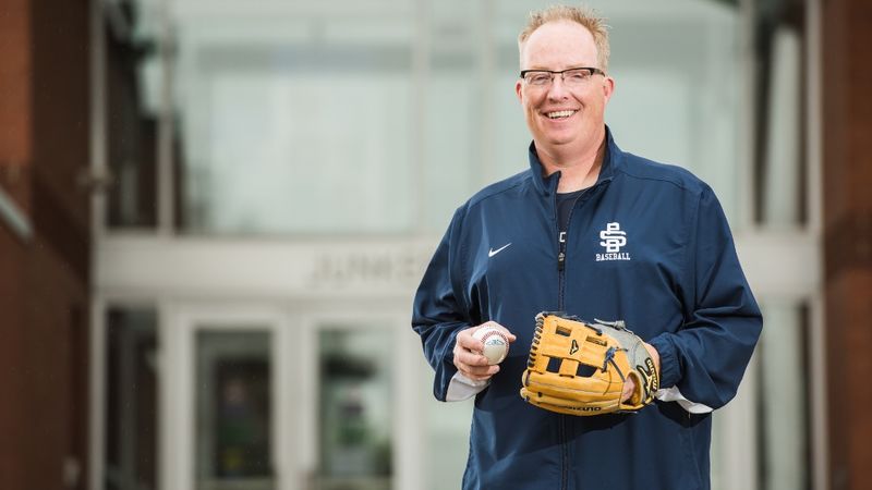 Paul Benim Penn State Behrend baseball coach Paul Benim stands in front of Junker Center.